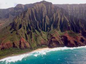 Grooved mountainside along the coast under an overcast sky, as seen from a helicopter - Nā Pali Coast, Kauai, Hawaii, USA | by Michael Scepaniak